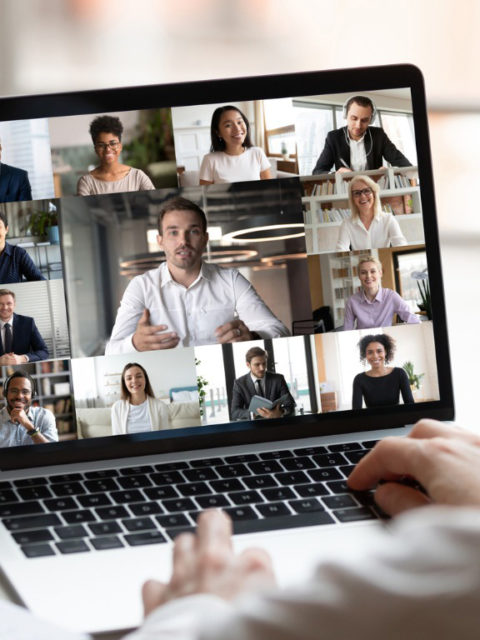 woman attending meeting via laptop
