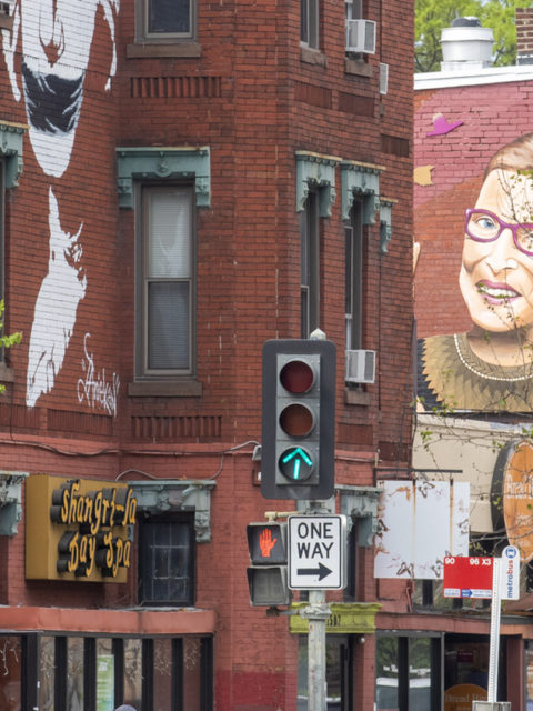 Washington DC street with Ruth Bader Ginsberg caricature on side of brick building