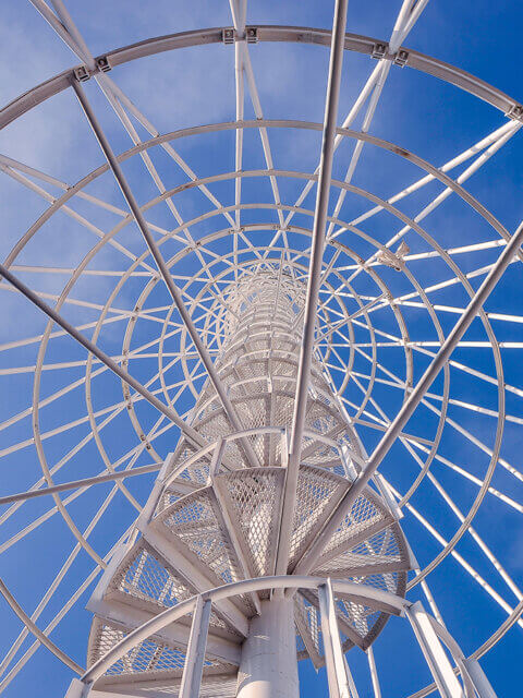 Telephone communication tower with spiral staircase