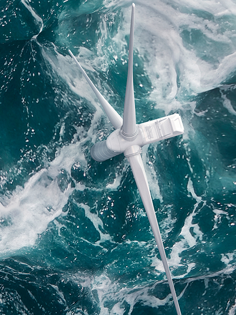 Aerial panorama of a wind turbine on the ocean