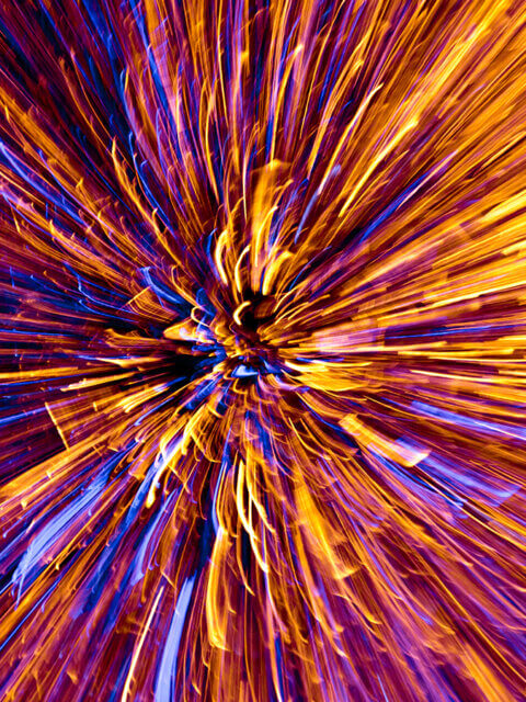 Timelapse, multicolored starburst from flying sparks