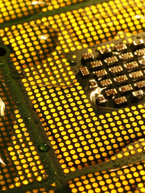 Closeup of aligned CPU chips with water drops