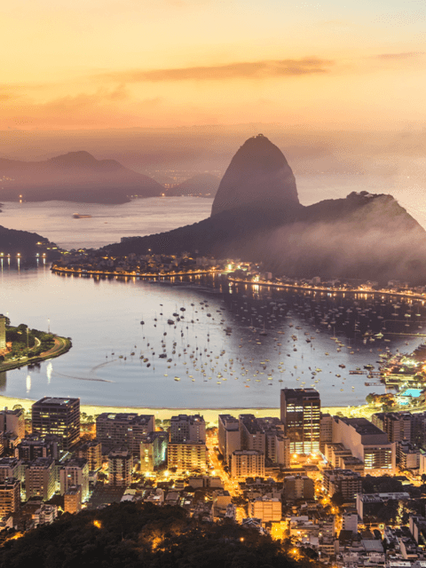 City of Rio de Janeiro at sunset with the Sugarloaf Mountain in the background.